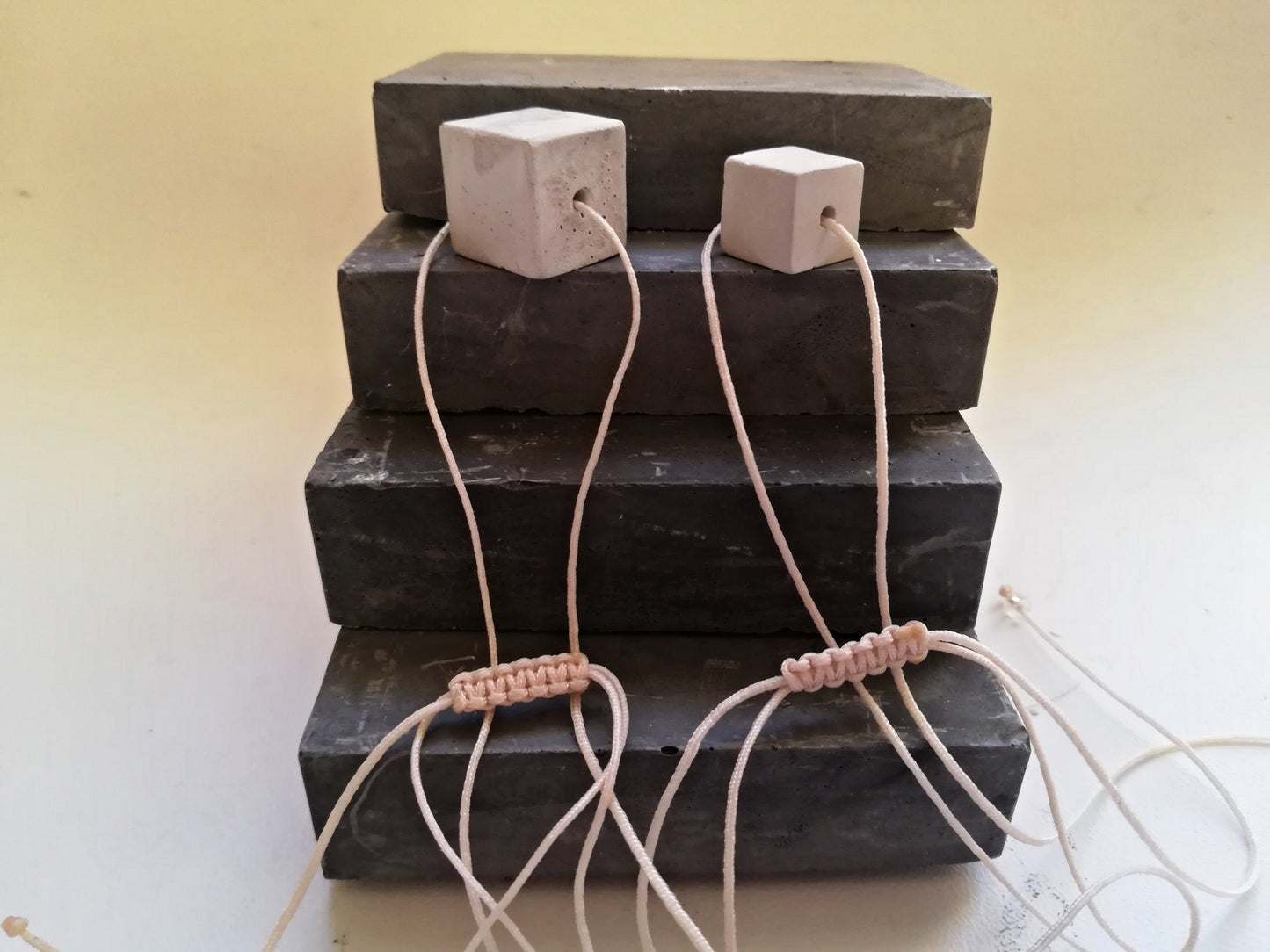 Concrete cube on a cord //gypsum plaster//