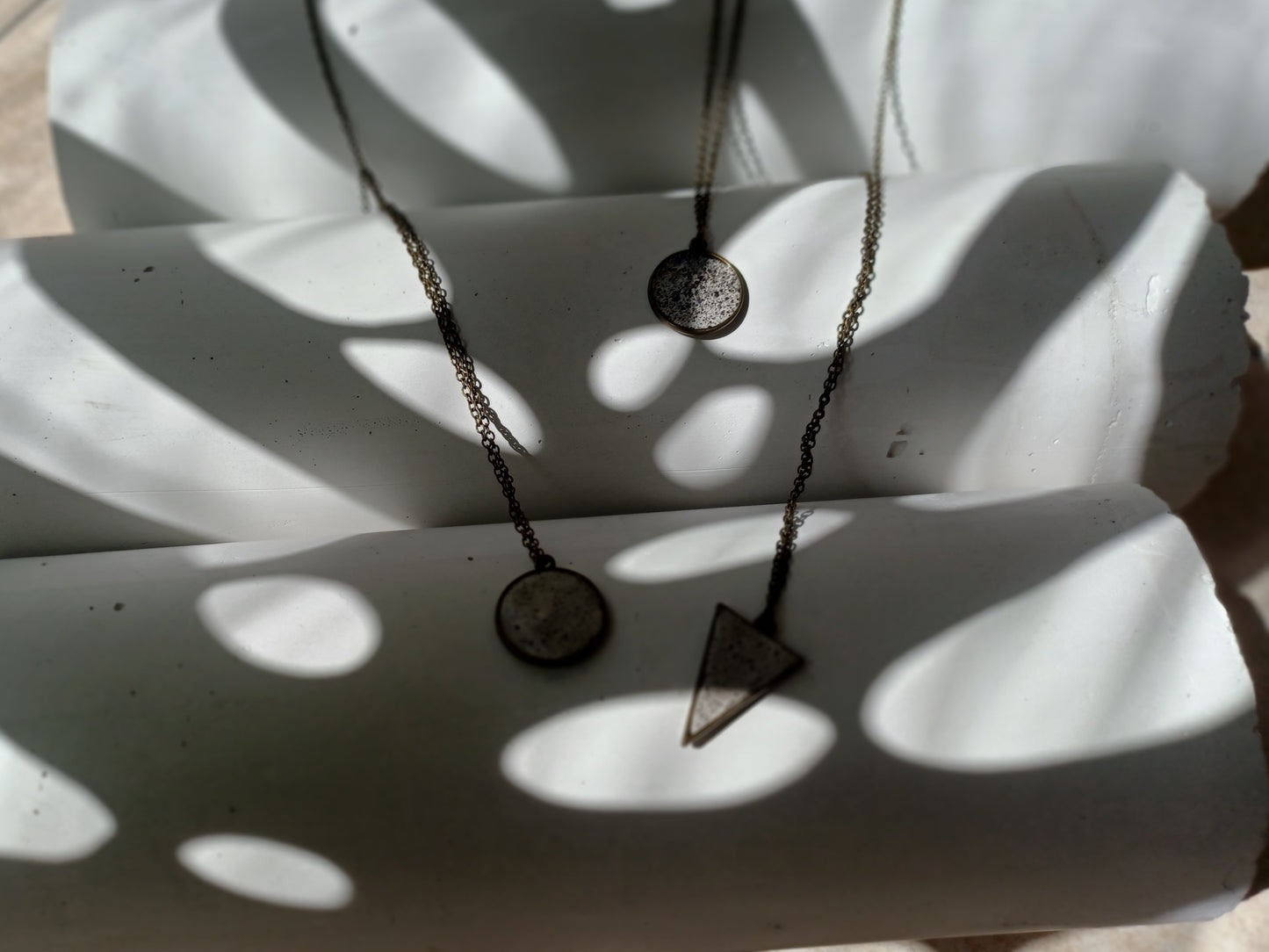 Brass pendant on a chain // gypsum freckled pendant