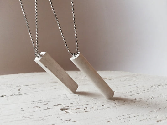 Concrete tube/rectangle on a ball chain //gypsum plaster//