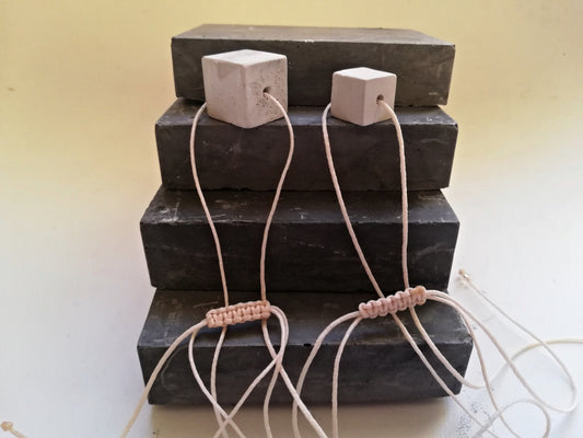 Concrete cube on a cord //gypsum plaster//