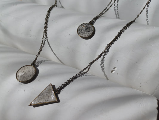 Brass pendant on a chain // gypsum freckled pendant