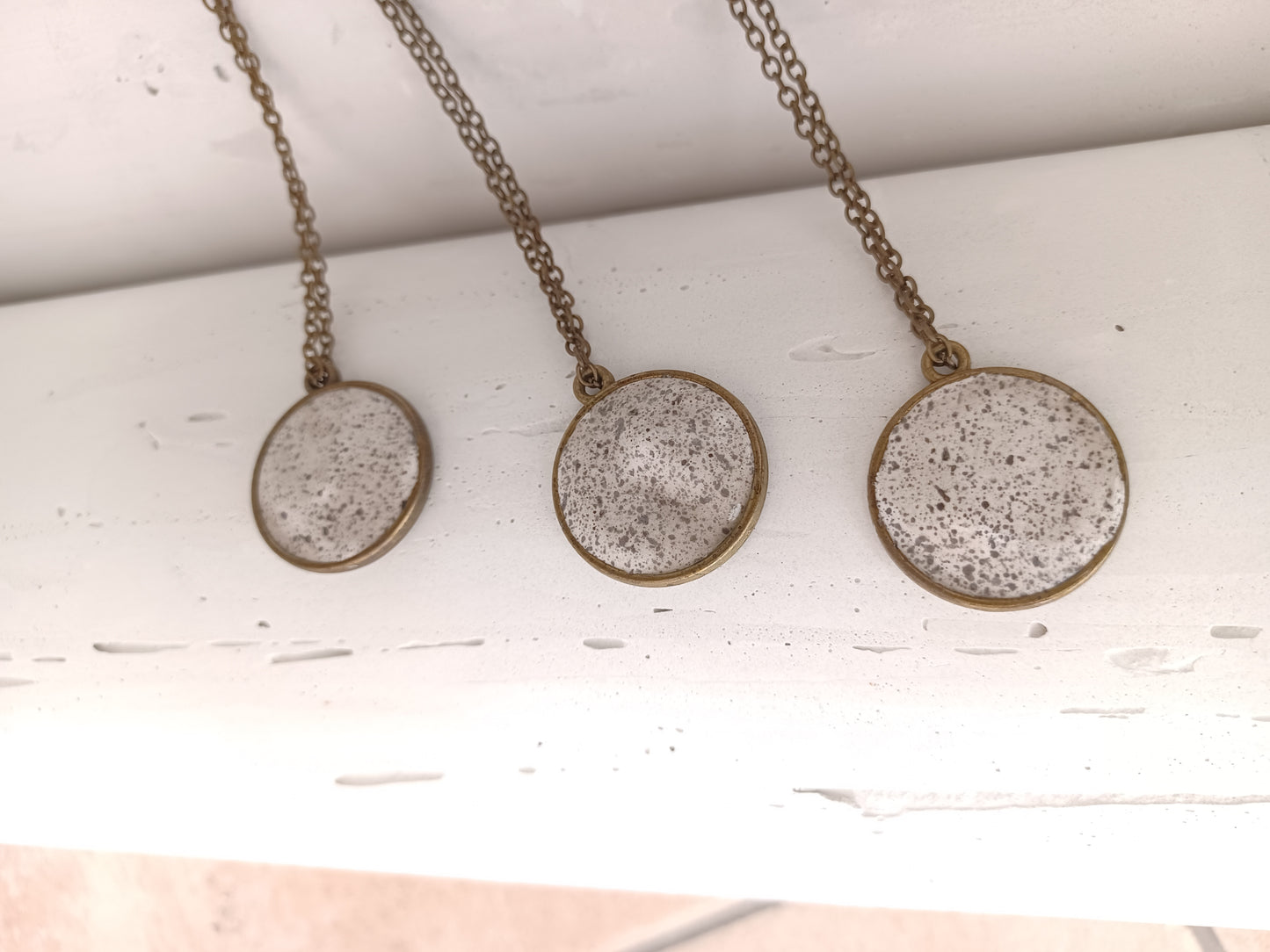 Brass pendant on a chain // gypsum freckled pendant