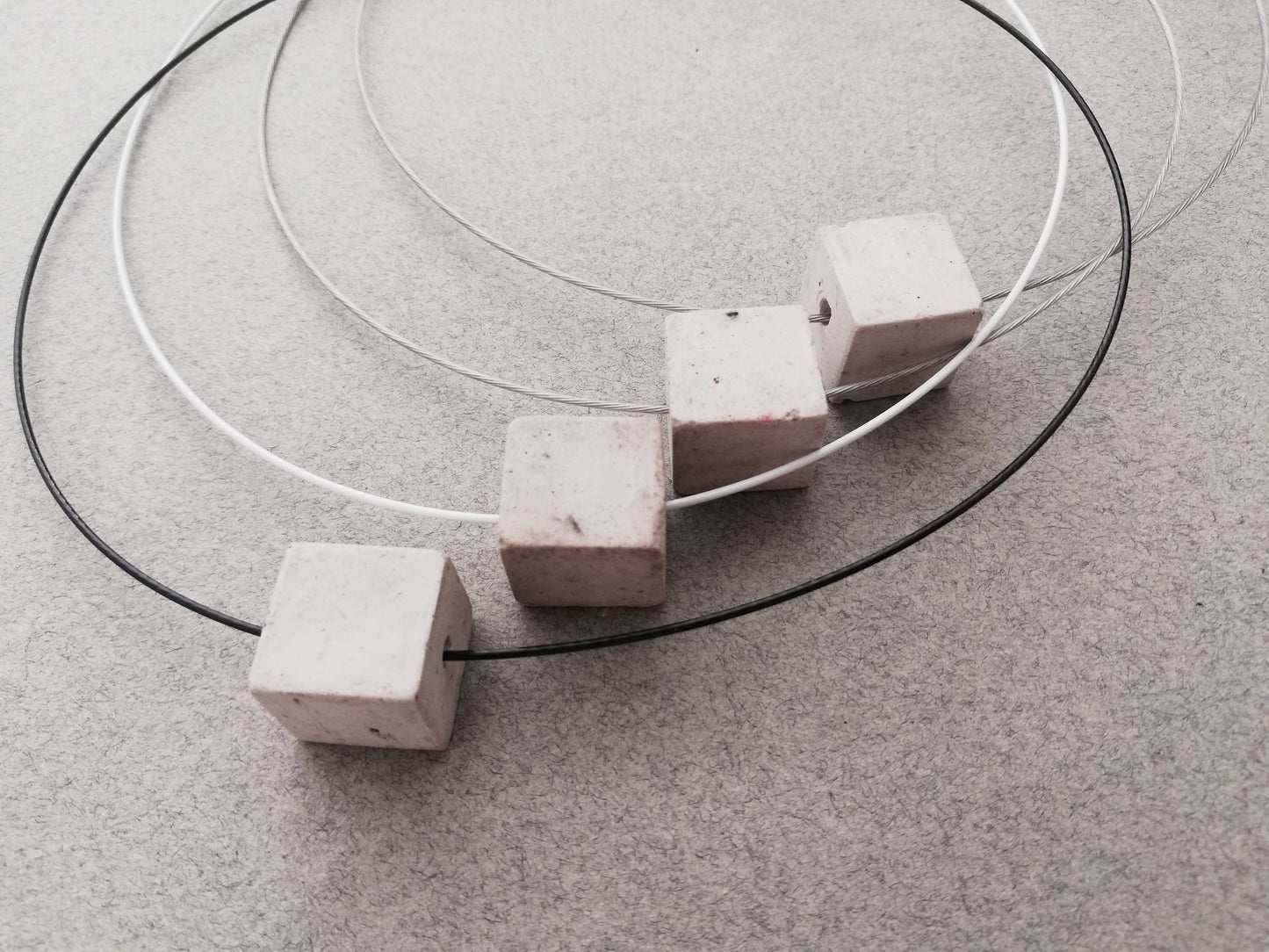 wire necklace // plaster gray cube